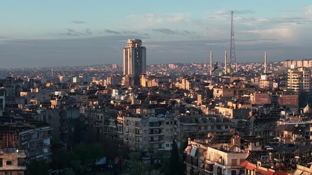 Drone view of a city landscape in Aleppo, Syria. Urban skyline and residential neighborhoods from above. City streets, infrastructure, and middle eastern architecture.