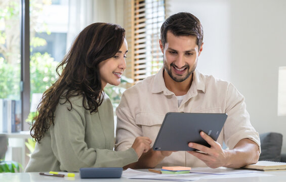 Couple using credit card pay the bill online shopping, making payment and browsing modern platform.