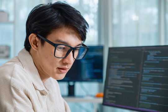 Developer software programmer computer coding screen working technology engineering monitor at modern workspace