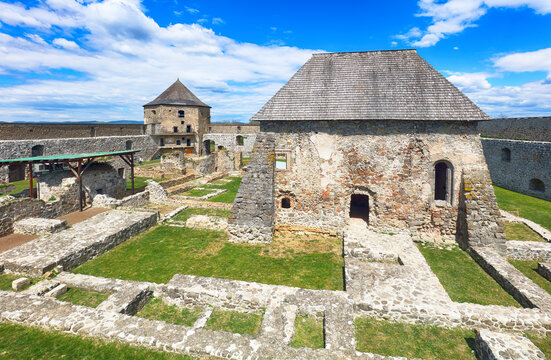 Bzovik, Bozok fortified monastery church in southern Slovakia with four round cannon towers and bridge.