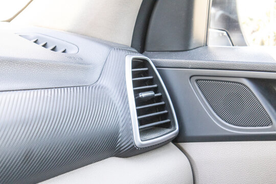 Side Air Conditioning Vent on Textured Car Dashboard