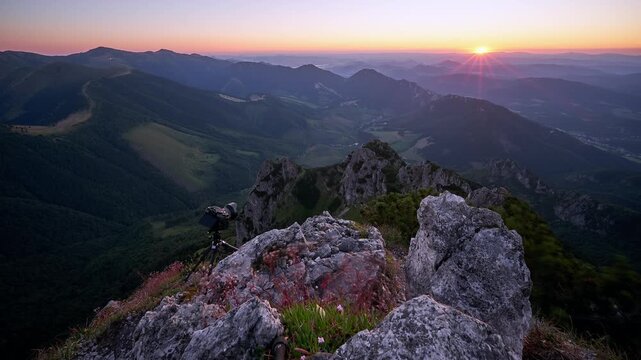 Mountain Summit Sunset Timelapse With Sun Rays Flare and Camera on Tripod Overlooking Valley