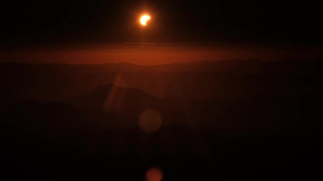 Partial Solar Eclipse Sunset Timelapse Over Mountains