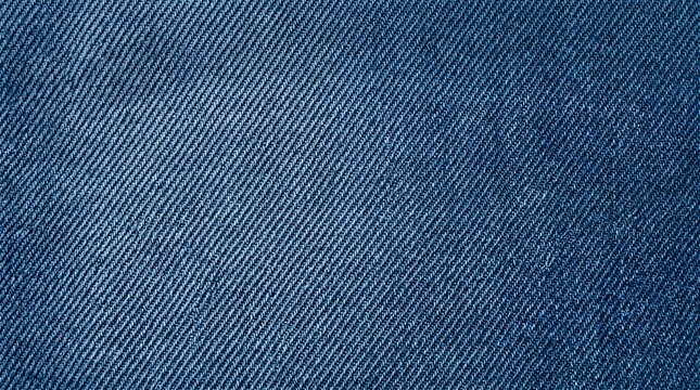 Closeup of blue denim fabric texture, detailed background of jeans material