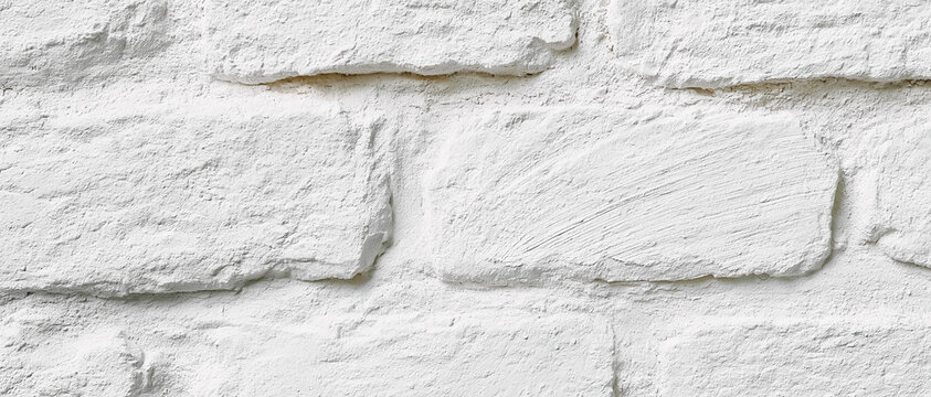 weathered whitewashed brick wall texture with peeling plaster and rustic patina for authentic sustainable interior design web banners advertising backgrounds editorial layouts
