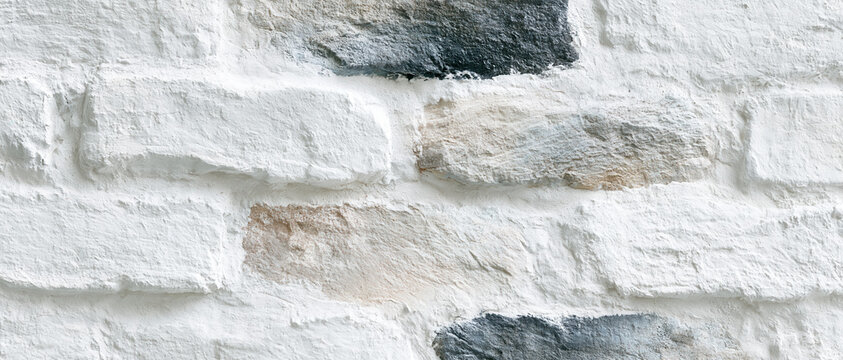weathered whitewashed brick wall texture with peeling plaster and rustic patina for authentic sustainable interior design web banners advertising backgrounds editorial layouts
