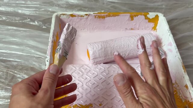 hands stained with paint. DIY home renovation.