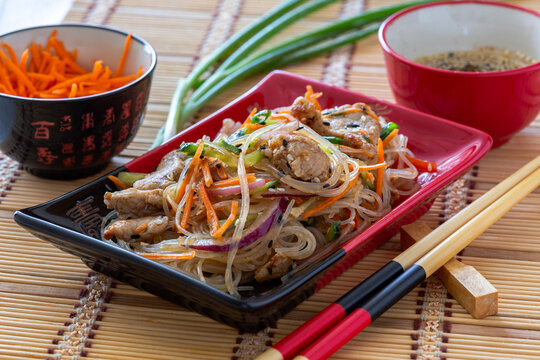 Stir-fried glass noodles with pork.