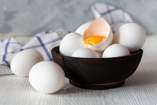 Fresh Eggs in Wooden Bowl.