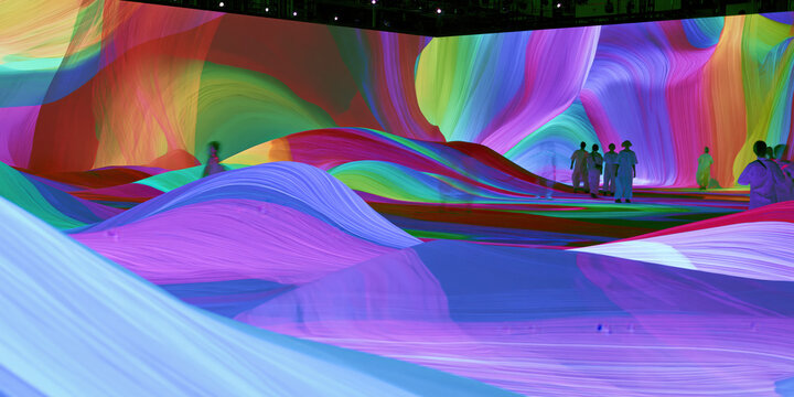 immersive digital aurora projection mapping installation envelops silhouetted visitors within flowing crimson cyan light waves across dark gallery walls for advertising web design
