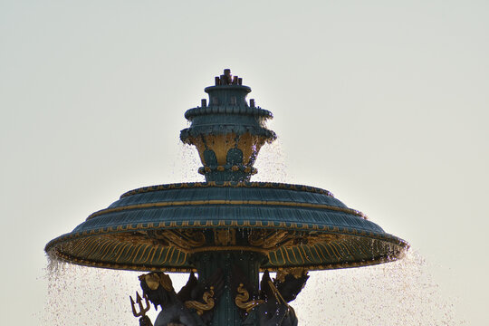 Backlit fountain spraying water at Place de la Concorde in Paris, France, August 11, 2026