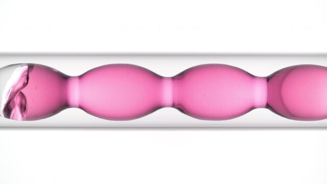 Gas bubbles pass through delicate pink clear solution as it fills and drains from a bulb lab condenser over clean white bg | Hyaluronic acid cosmetic product ingredient concept