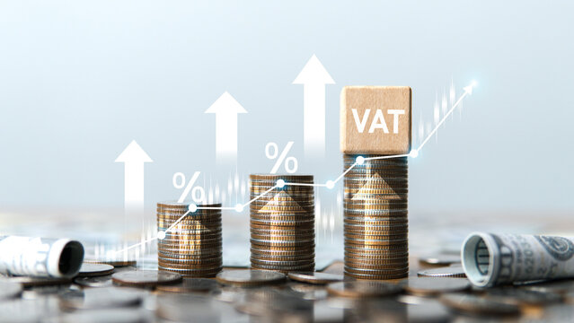 The stack of coins is arranged from lowest to highest, with the letters VAT and an upward-pointing arrow indicating an increasing tax burden or a gradually rising tax rate.