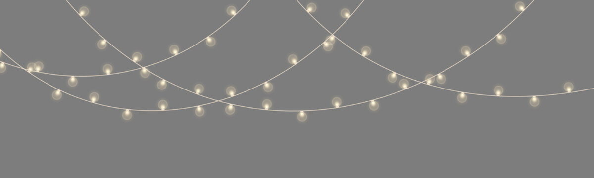 Softly glowing warm yellow string lights draped in curved layered rows on black background on transparent background