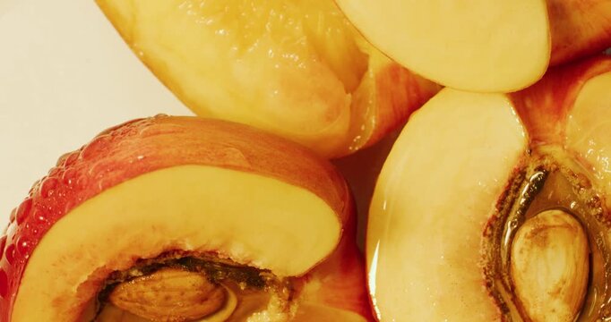 Juicy nectarine flesh. Сut in half nectarine. A nectarine pit.