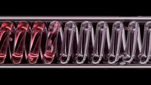 Ultra close view of transparent red fluid flowing through a horizontally mounted coil laboratory condenser set against black