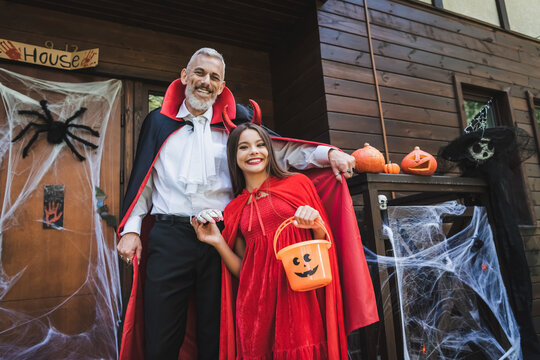 Mother and child celebrate Halloween with joy and festive spirit outdoors