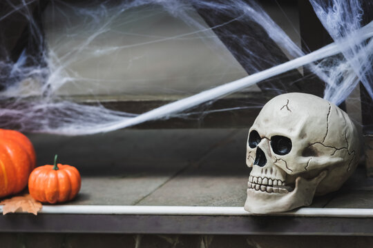 Spooky Halloween decorations create a festive atmosphere on the porch