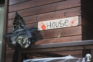Fototapeta premium Spooky decorations brighten the porch for Halloween celebration