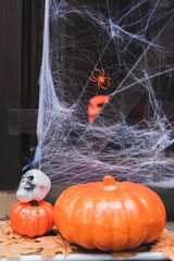 Fototapeta premium Spooky Halloween decorations brighten up a festive porch