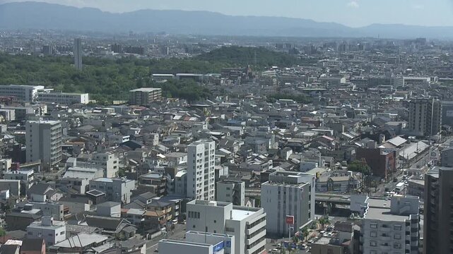 Footage panning from right to left over a bird's-eye view of Sakai City, Osaka.