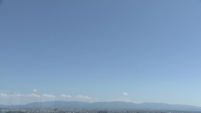 Aerial footage panning down over a bird's-eye view of Sakai City, Osaka.