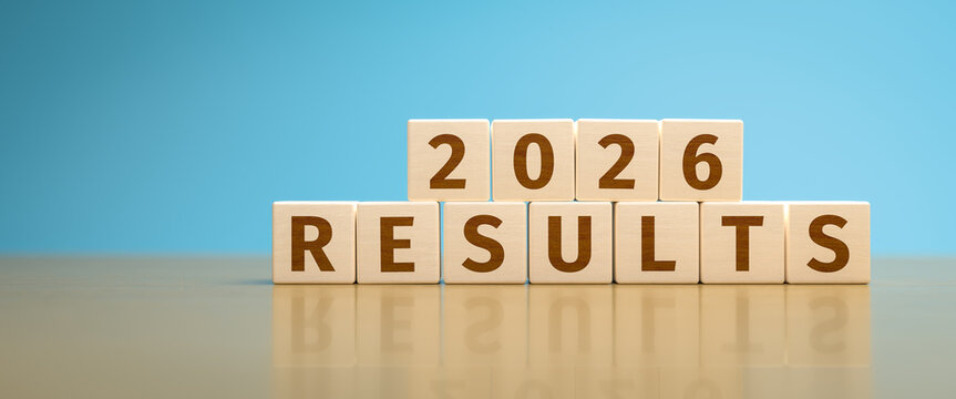 Wooden toy cubes forming the text "2026 RESULTS". Concept for financial or other results of the year 2026 of an organisation or company.