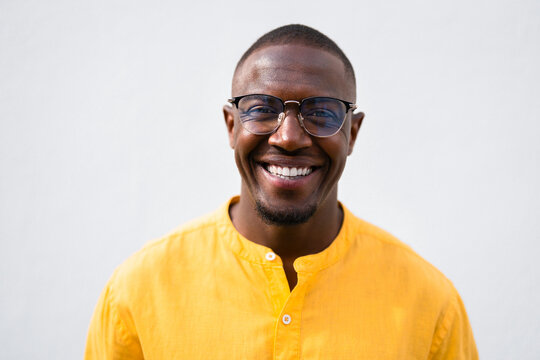 African american man, businessman close headshot, laughing face and cheerful smiling expression in casual isolated studio for business profile picture. Young closeup consultant portrait with natural