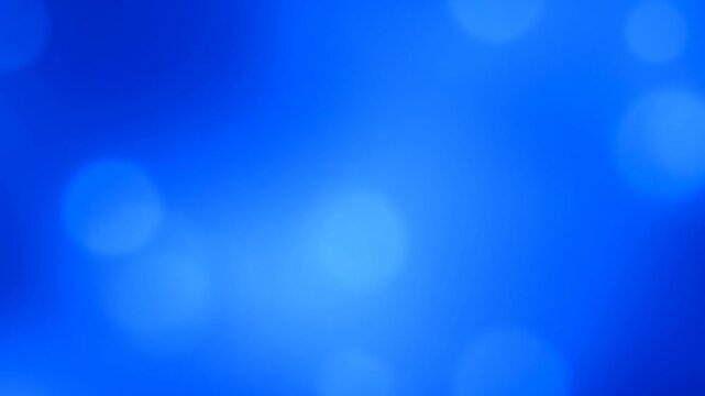 Blue abstract gradient with soft glowing light patches and subtle shifting illumination