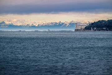 Naklejka premium Trieste in winter. Between the sea, snow-capped mountains, and historic monuments.