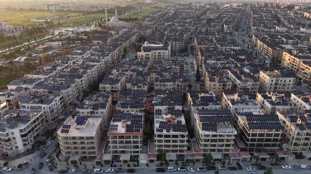Drone view of a city landscape in Aleppo, Syria. Urban skyline and residential neighborhoods from above. City streets, infrastructure, and middle eastern architecture.