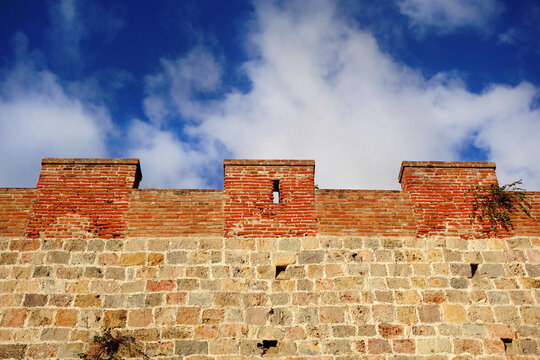 Pisa medieval walls with clouds