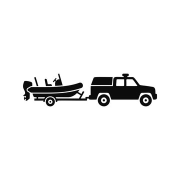 Black silhouette of a truck with camper shell towing a motorboat