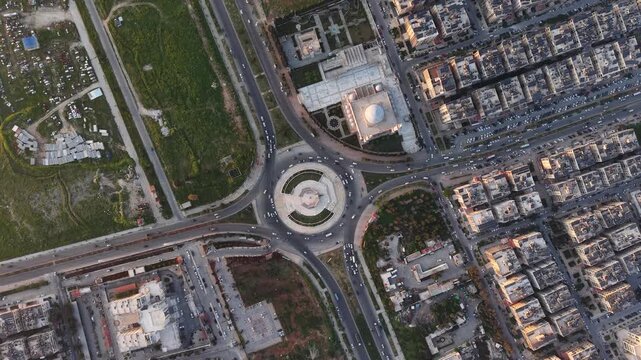 Drone view of a city landscape in Aleppo, Syria. Urban skyline and residential neighborhoods from above. City streets, infrastructure, and middle eastern architecture.