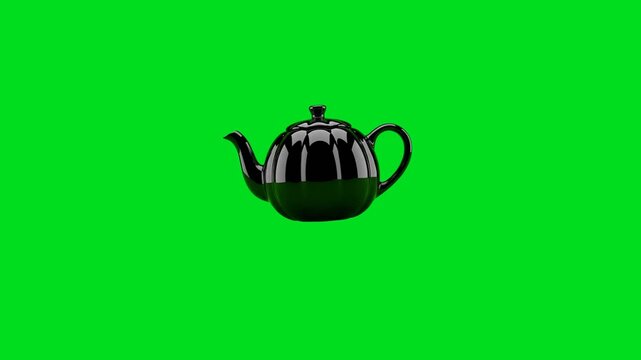 A sleek black ceramic teapot centered against a vibrant chroma key green background