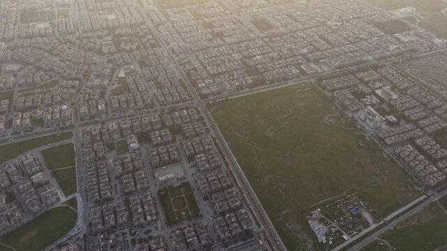 Drone view of a city landscape in Aleppo, Syria. Urban skyline and residential neighborhoods from above. City streets, infrastructure, and middle eastern architecture.
