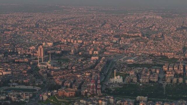 Drone view of a city landscape in Aleppo, Syria. Urban skyline and residential neighborhoods from above. City streets, infrastructure, and middle eastern architecture.