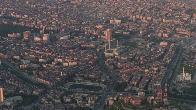 Drone view of a city landscape in Aleppo, Syria. Urban skyline and residential neighborhoods from above. City streets, infrastructure, and middle eastern architecture.