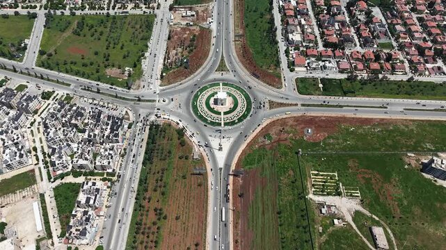 Drone view of a city landscape in Aleppo, Syria. Urban skyline and residential neighborhoods from above. City streets, infrastructure, and middle eastern architecture.