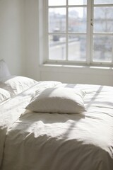 Obraz premium Minimal Modern Bedroom with White Bedding, Soft Morning Sunlight and Empty Pillow Area for Product Placement