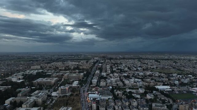 Drone view of a city landscape in Aleppo, Syria. Urban skyline and residential neighborhoods from above. City streets, infrastructure, and middle eastern architecture.