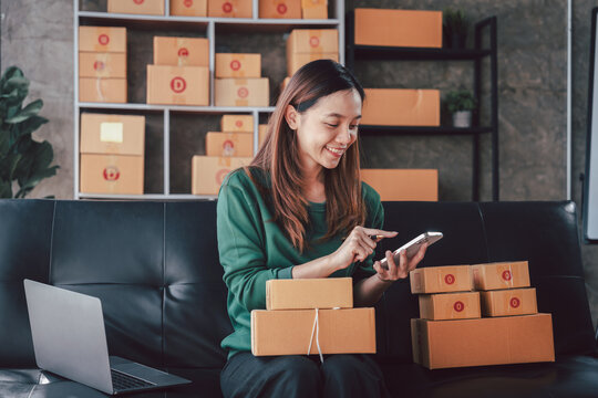 Asian Young Woman Managing Online Store Inventory Checking Order