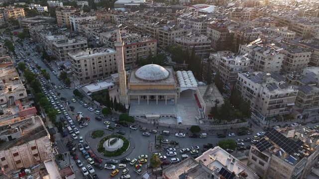 Drone view of a city landscape in Aleppo, Syria. Urban skyline and residential neighborhoods from above. City streets, infrastructure, and middle eastern architecture.