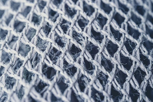 Extreme macro view of nylon textile fibers detailed woven structure and surface texture. Synthetic fiber material with fine thread