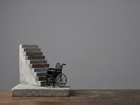 Wheelchair Facing Inaccessible Stairs Symbolizing Frustrating Barriers to Equal Access