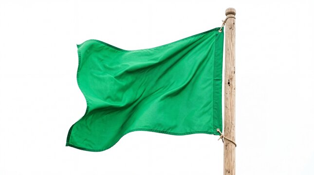 Vibrant green fabric flag waving elegantly on wooden flagpole showing realistic fabric texture captured in bright daylight on white background