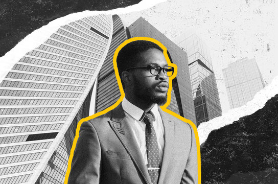 Focused Black Man In Business Suit Wearing Glasses, Standing In Urban Office Setting, Engaged In Professional Activity. Business Concept Representing Success And Confidence.