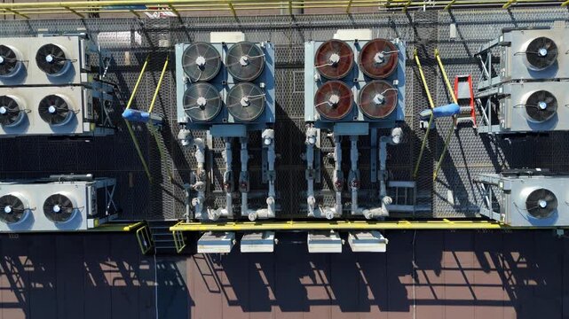 Aerial view of HVAC server cooling fans and ventilation units installed on a data center rooftop in Andover, England, United Kingdom.