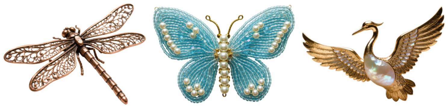 Three decorative brooches: a bronze dragonfly, a blue beaded butterfly with pearls, and a golden crane with mother-of-pearl inlay, isolated on a white background.