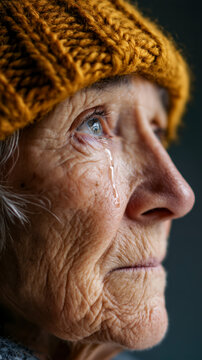 The Weight of Years: A Tearful Eye in a Knitted Hat